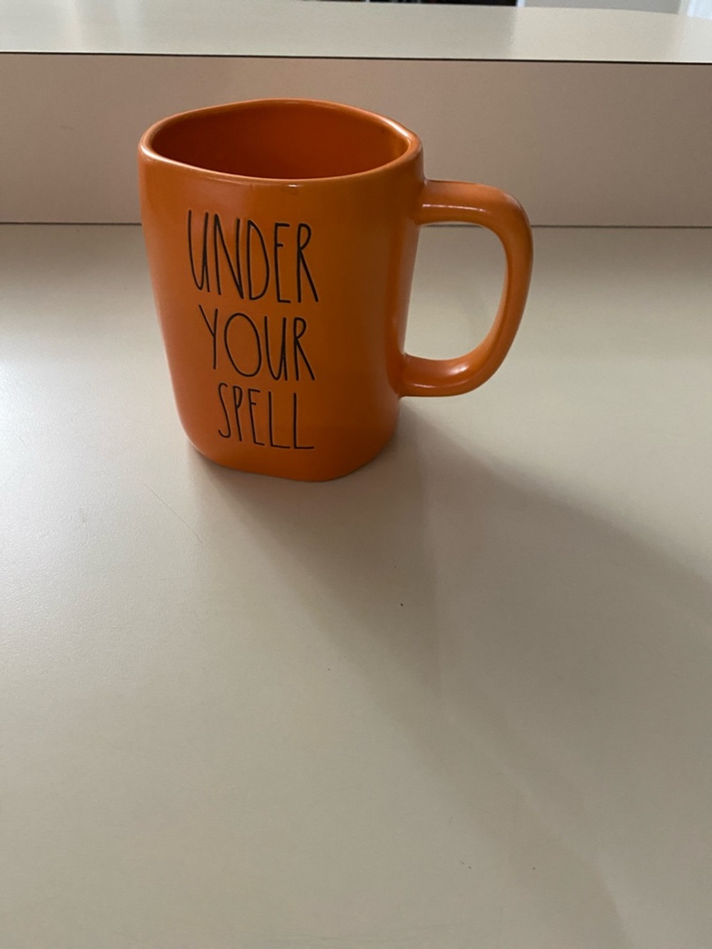 Orange 'Under Your Spell' writing Ceramic Mug